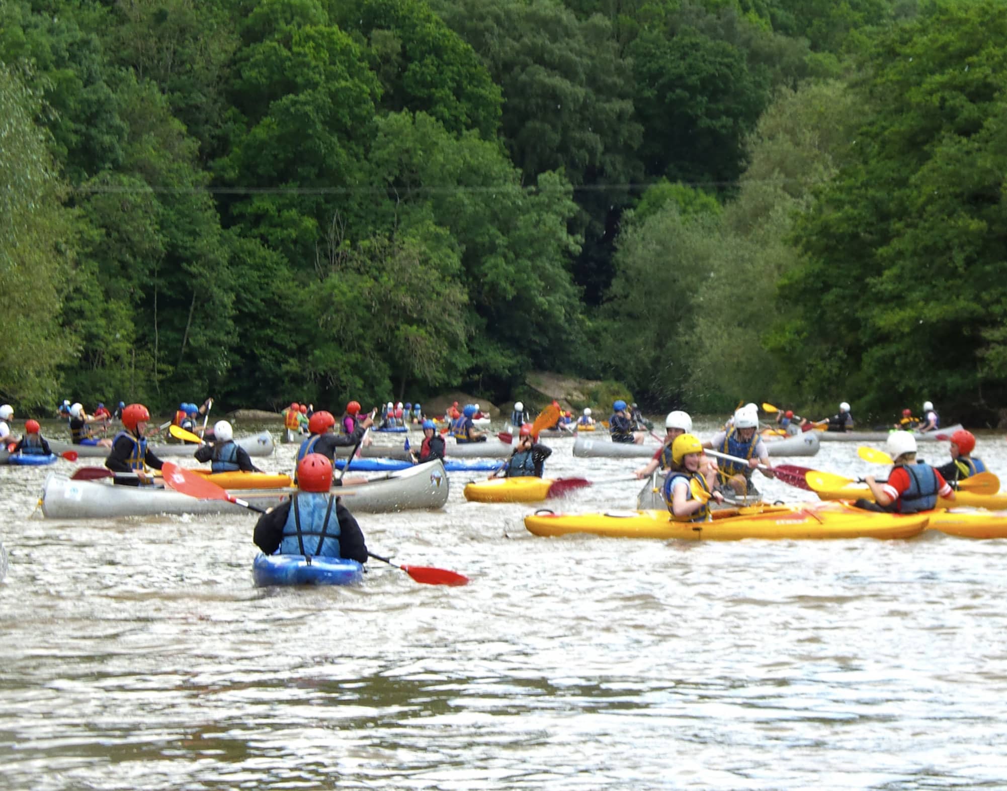 School groups enjoying their canoeing and kayaking experience on the River Wye